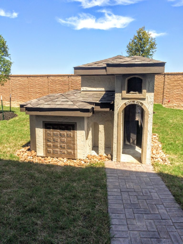 Dog-friendly houses being offered by national builder. This is a replica of the main house for the dog. 