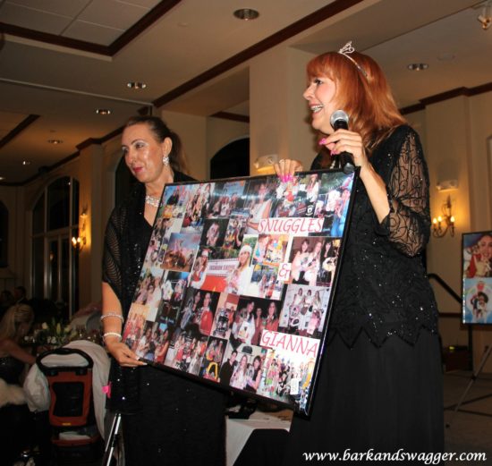 Designer dog fashions' big night at the Fabulous Cotillion. Here, Brygida Tr presents Laura Souza with a collage of memories of recently deceased Snuggles.