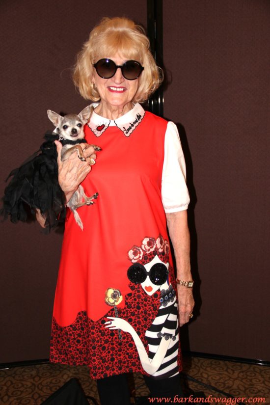Designer dog fashions big night at the Fabulous Cotillion. Here, seminal designer Linda Higgins rocks a pop culture inspired dress with her little dog, Lucy. 